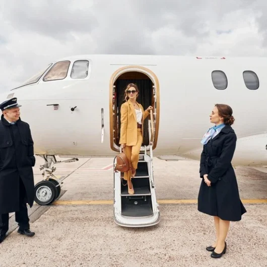 landing-is-done-airplane-crew-leads-woman-yellow-clothes-from-plane